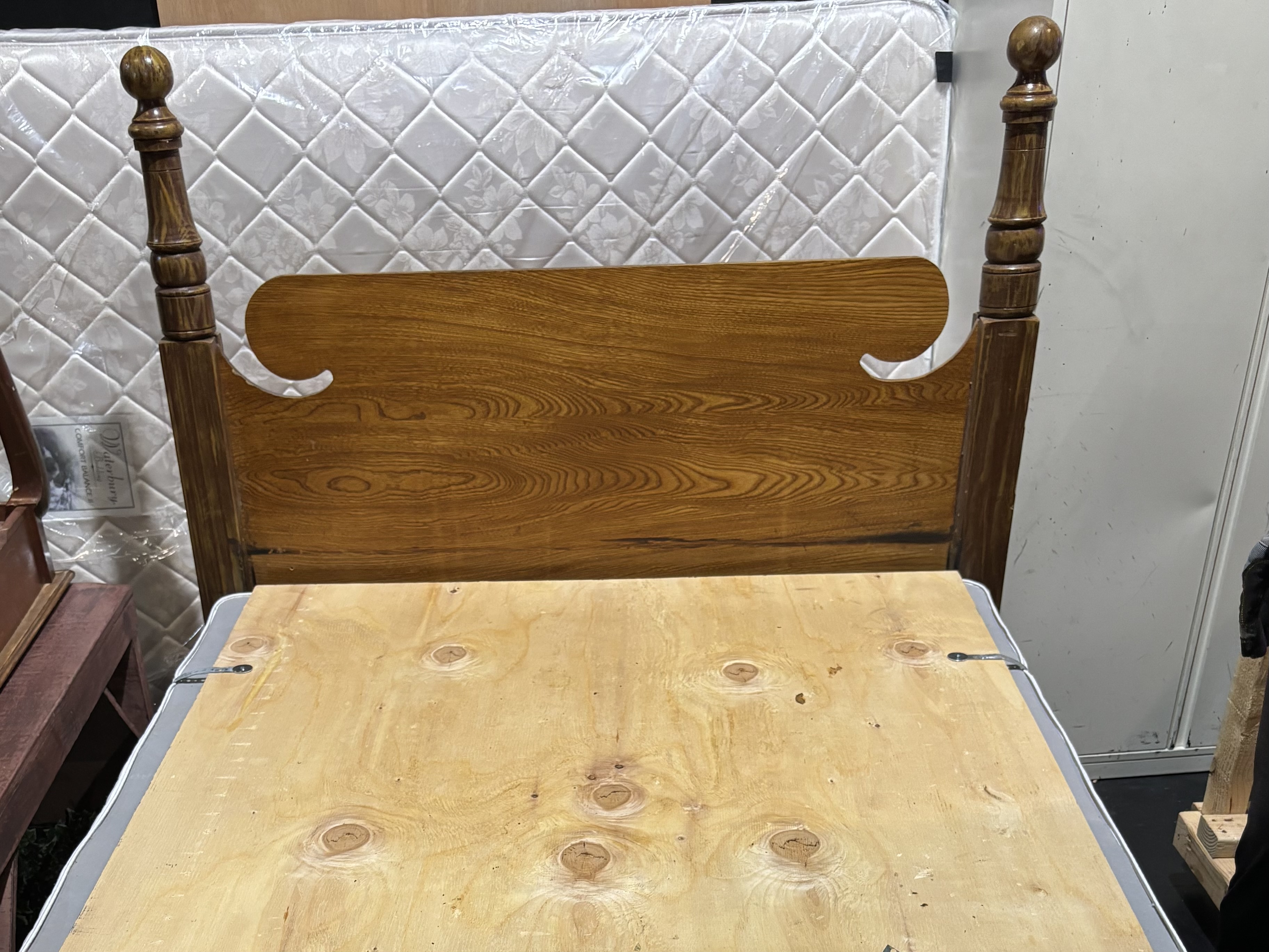 bed with plywood on top